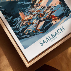 Saalbach Wall Art Poster showcasing a winter landscape of Saalbach, Austria with snowy slopes and charming buildings.