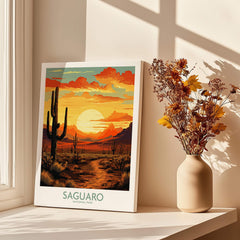 Saguaro National Park print with desert sunset, cacti, and mountains on a sunlit windowsill.