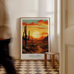 Framed Saguaro National Park poster with desert sunset and cacti on floor, man walking by