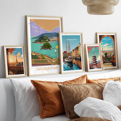 San Sebastian Poster Print displayed among other travel artwork on a stylish wall, adding charm to home decor.