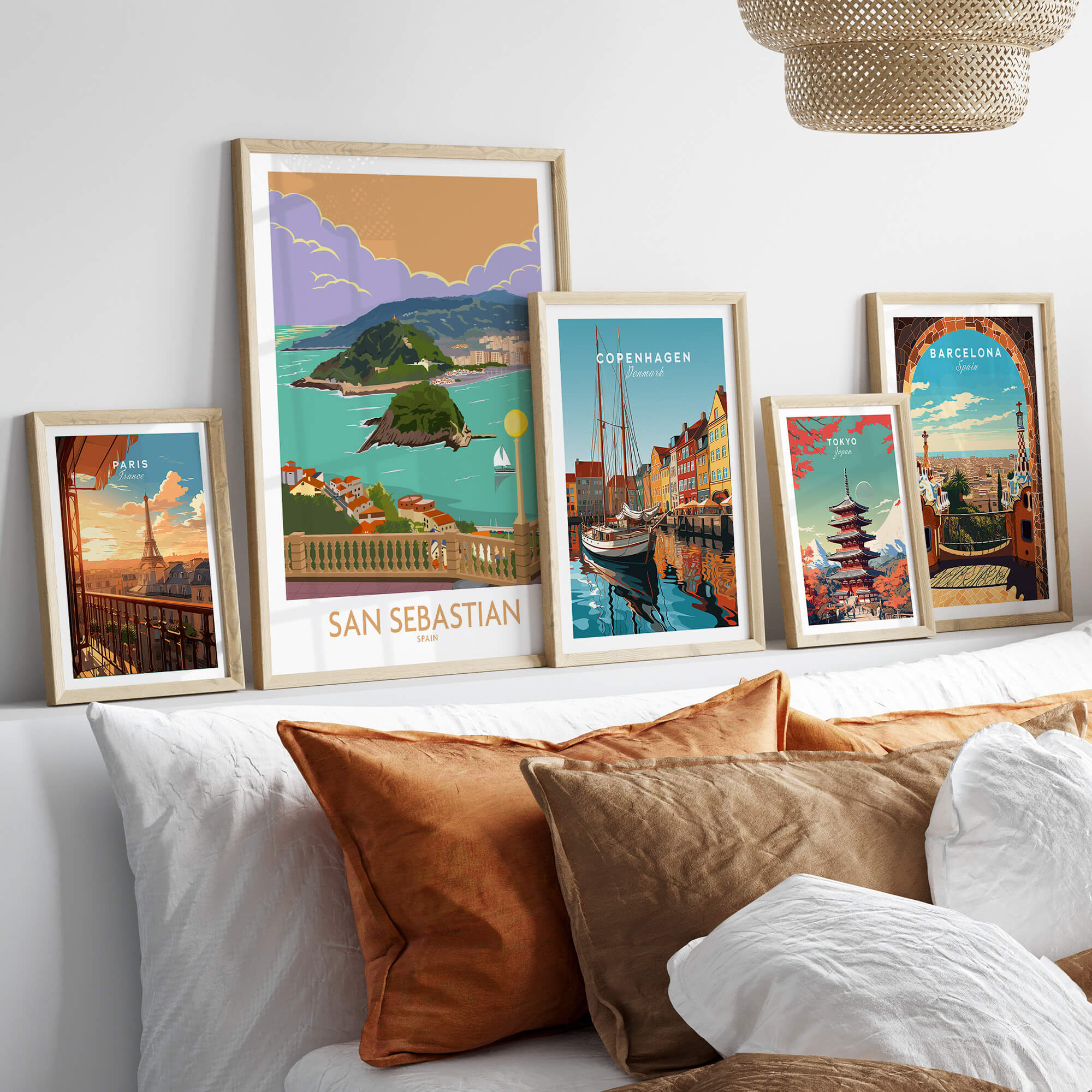 San Sebastian Poster Print displayed among other travel artwork on a stylish wall, adding charm to home decor.