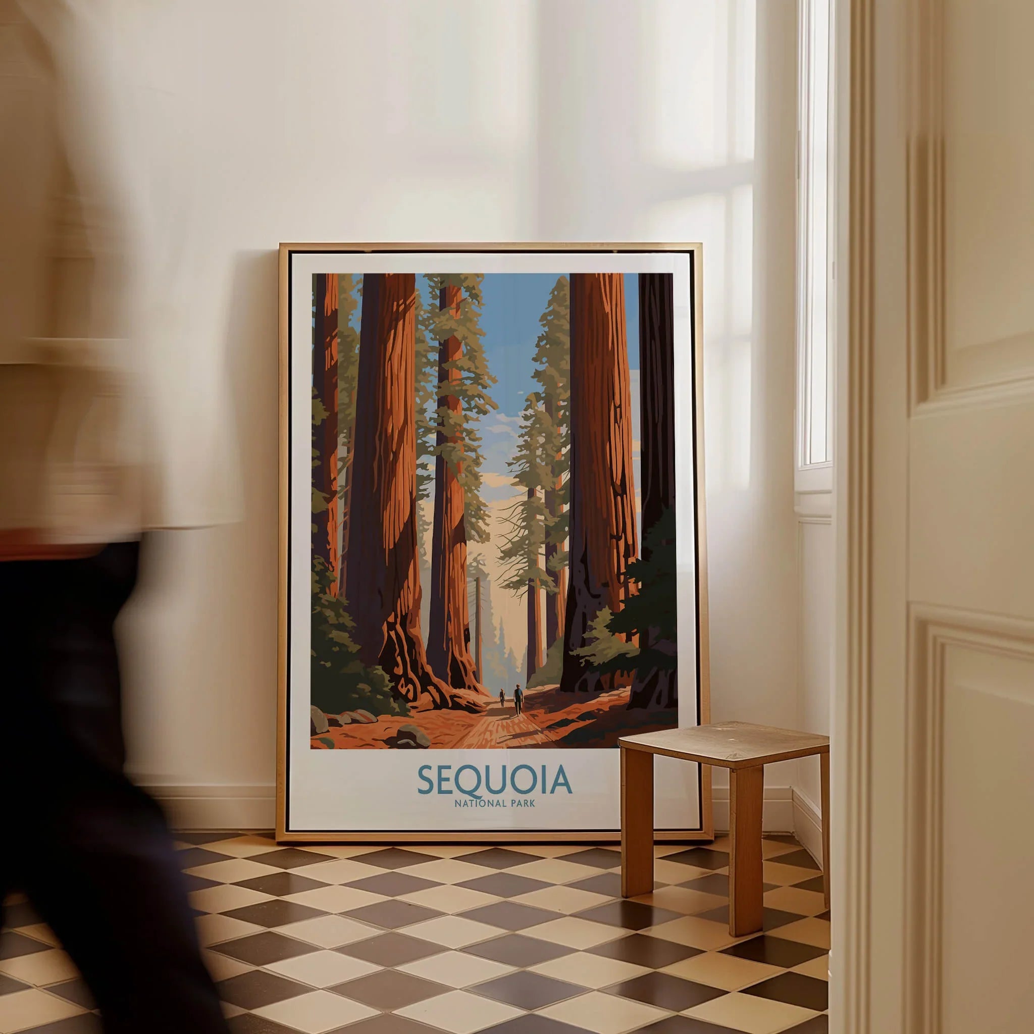 Sequoia National Park framed travel poster on floor in modern hallway, man walking past