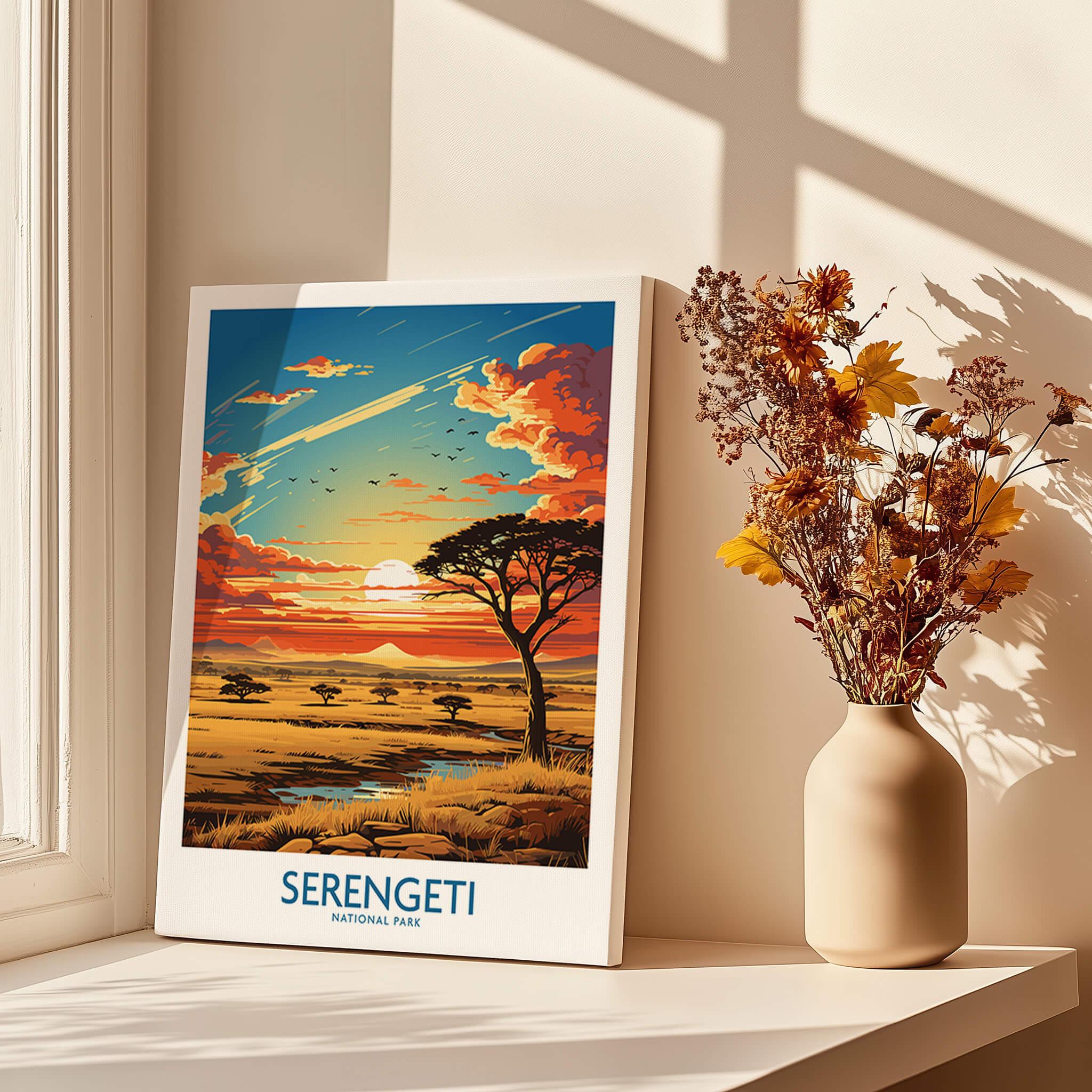 Serengeti National Park poster with sunset landscape, acacia trees, and vase of dried flowers on windowsill