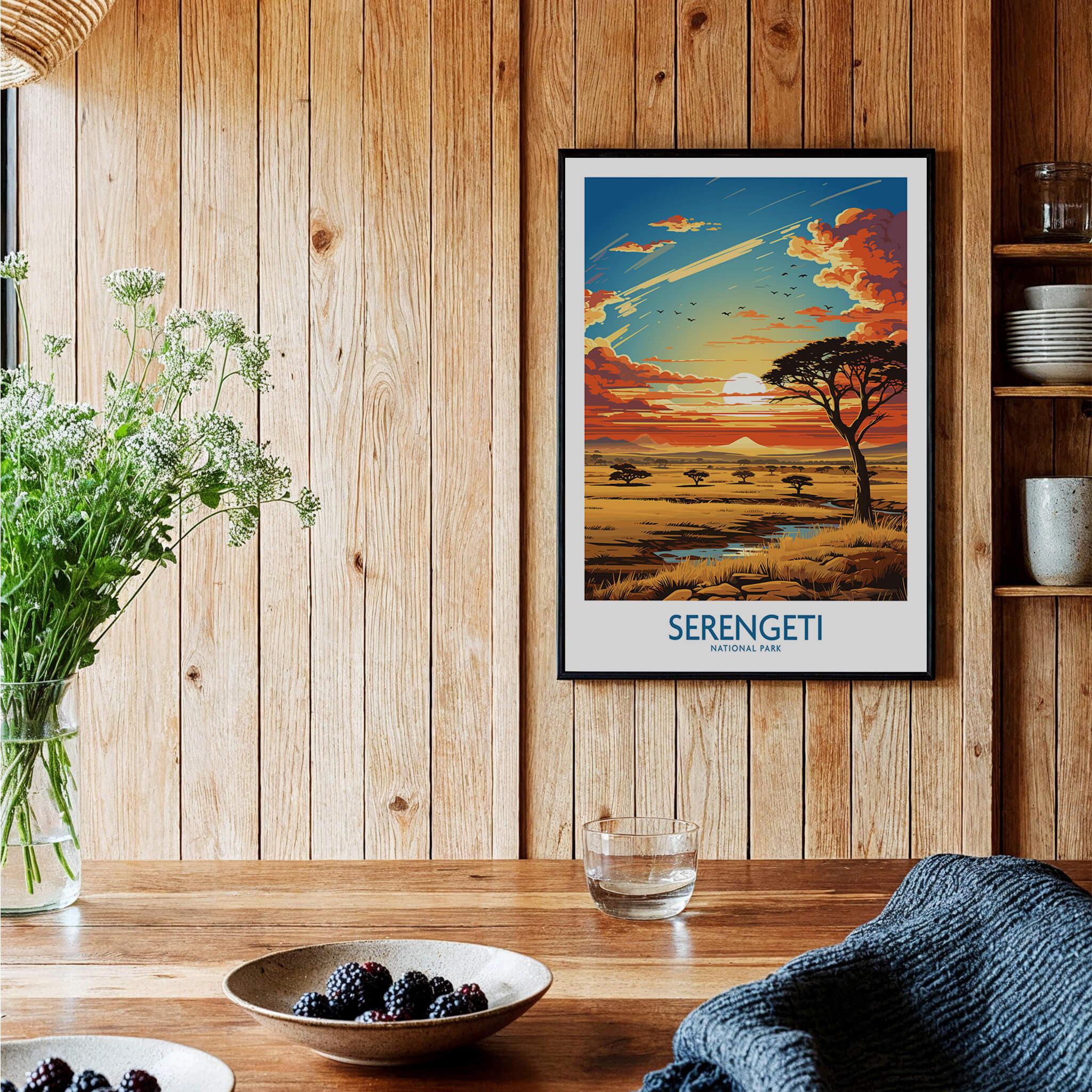 Serengeti National Park art print in black frame on wooden kitchen wall with rustic decor.