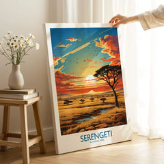 Serengeti National Park sunset travel poster on canvas, hand-held in cozy room setting