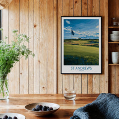 St Andrews Print Scotland - Golf Course Poster displayed on wooden wall near plants and bowls.