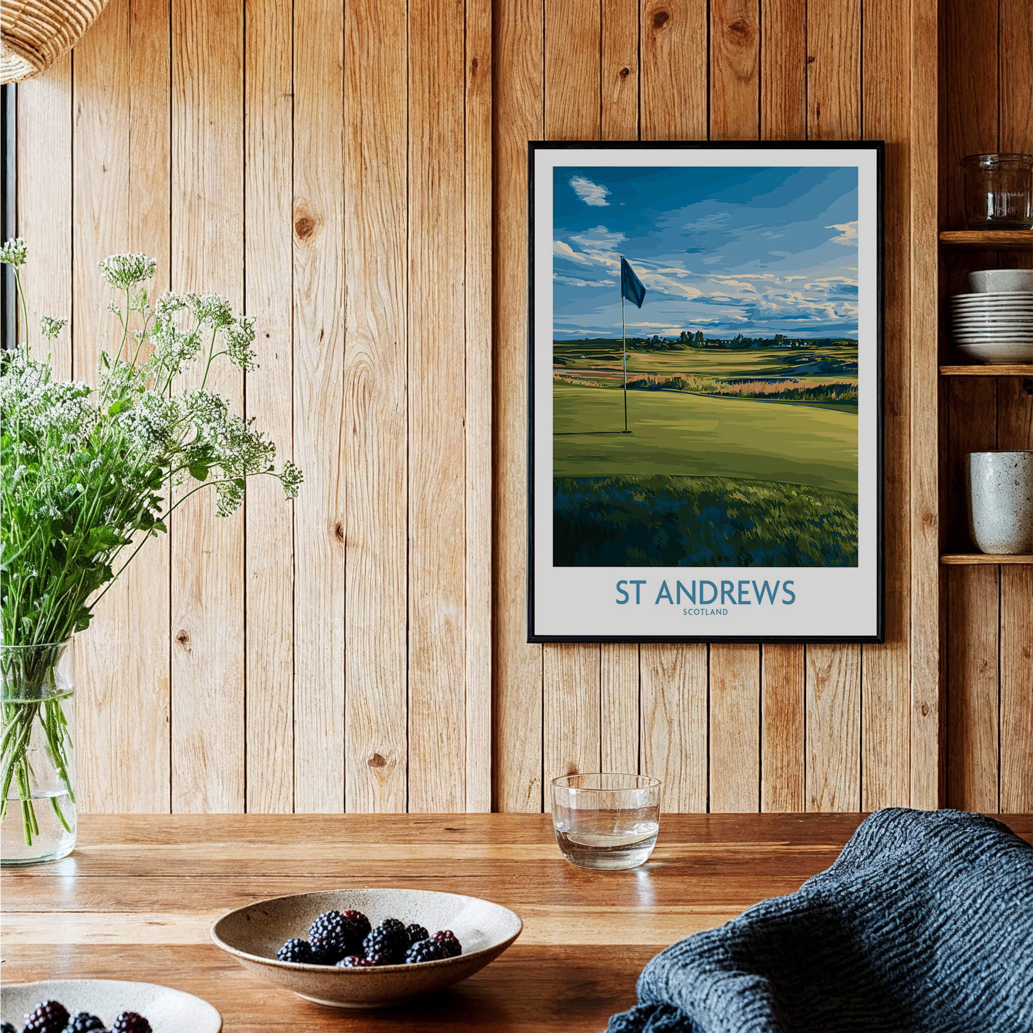 St Andrews Print Scotland - Golf Course Poster displayed on wooden wall near plants and bowls.