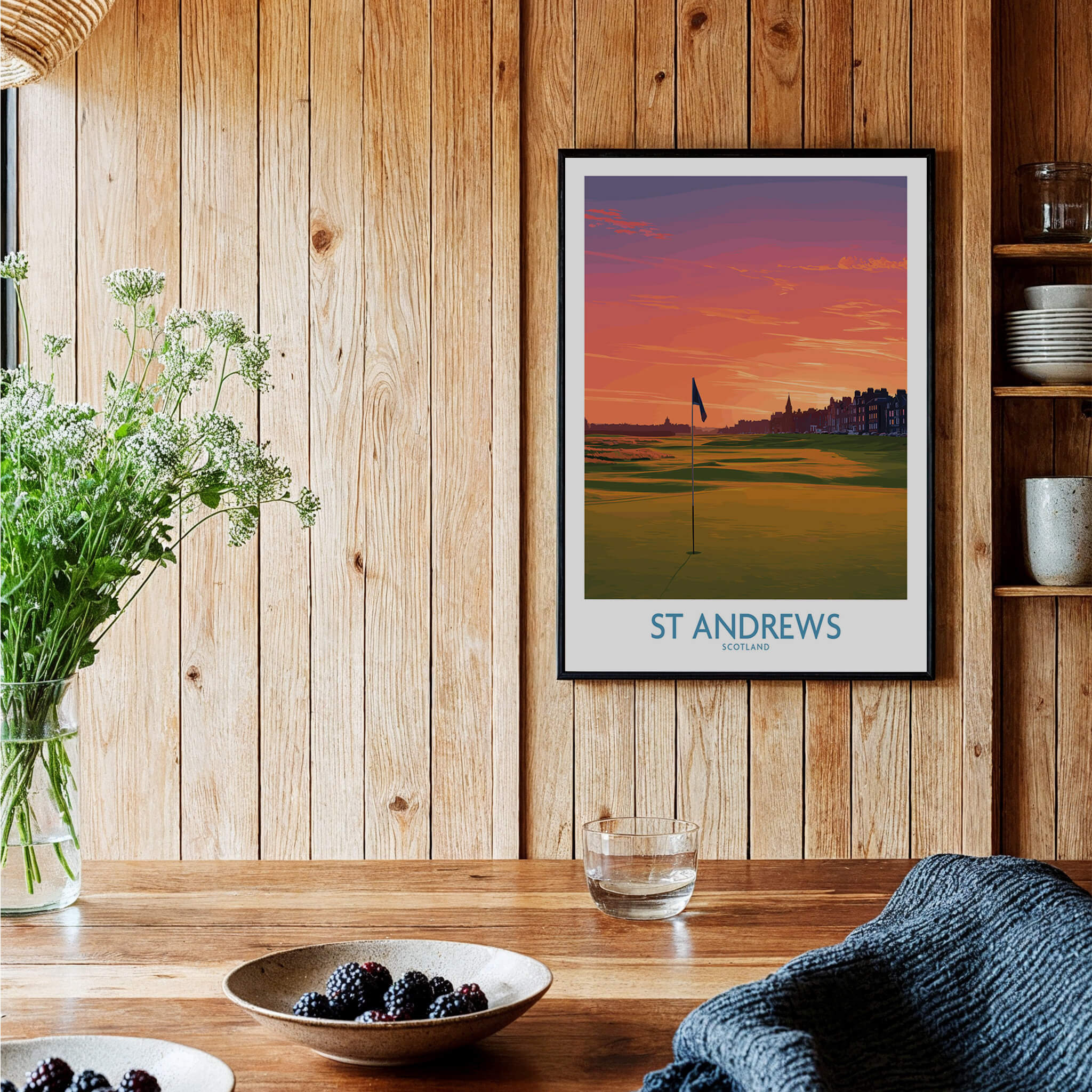 St Andrews Scotland Historic Golf Course Wall Art - Scotland Poster Print framed on wooden wall with plants and tableware.
