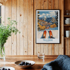 Telluride Wall Art Ski Poster displayed in a cozy interior, showcasing stunning mountain scenery and skiing excitement.
