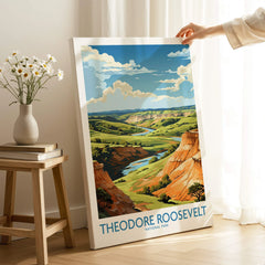 Hand holding Theodore Roosevelt National Park print with scenic landscape in bright room