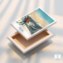 Trysil Ski Wall Art Ski Poster displayed on a wooden box, showcasing a snowy mountain landscape with a skier.