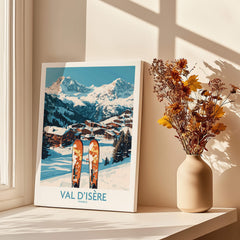 Val-d'Isère Ski Poster showcasing stunning winter landscape with skis and a cozy home setting.