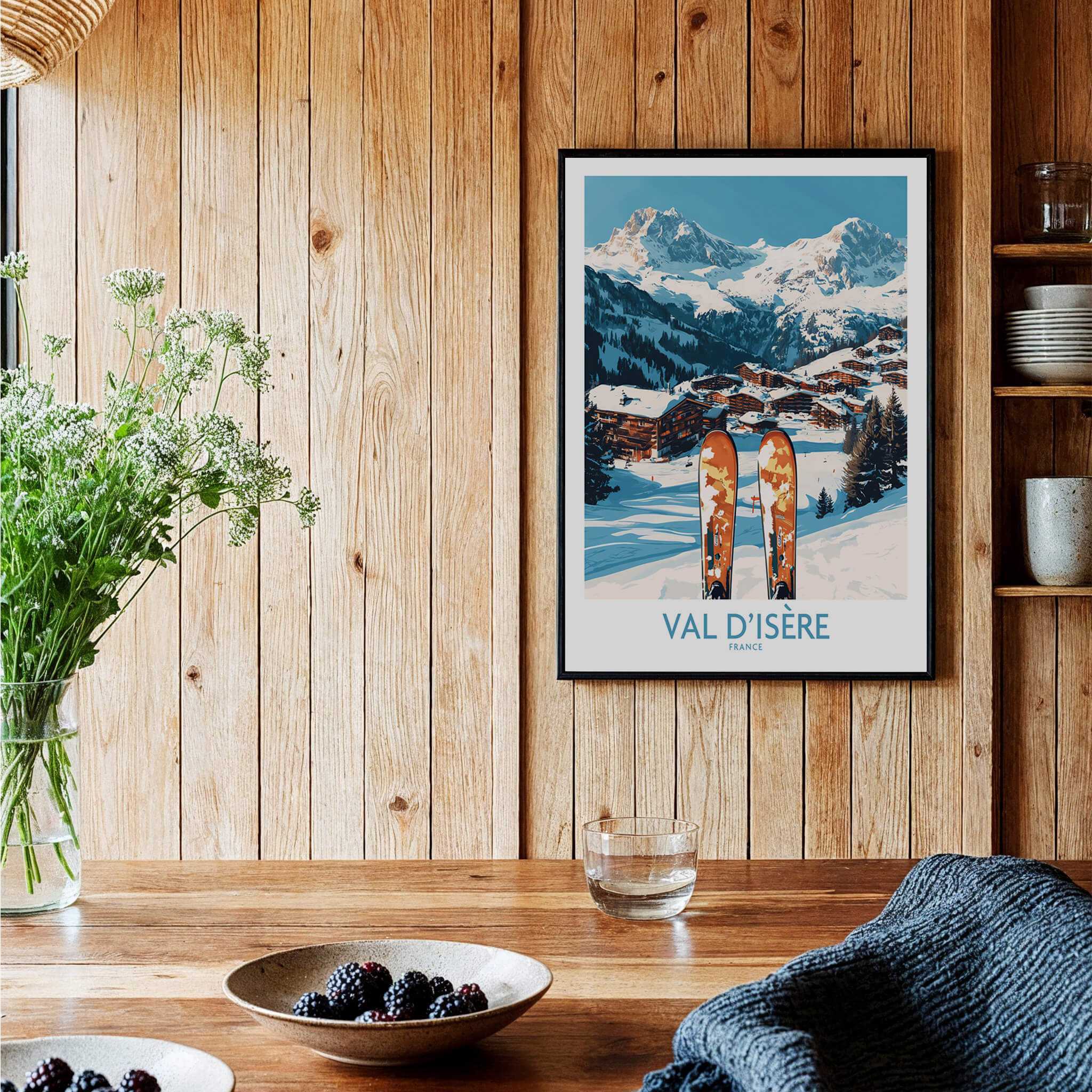 Val-d'Isère Ski Poster displayed in a cozy setting with wooden wall and ski equipment, ideal for winter sports enthusiasts.