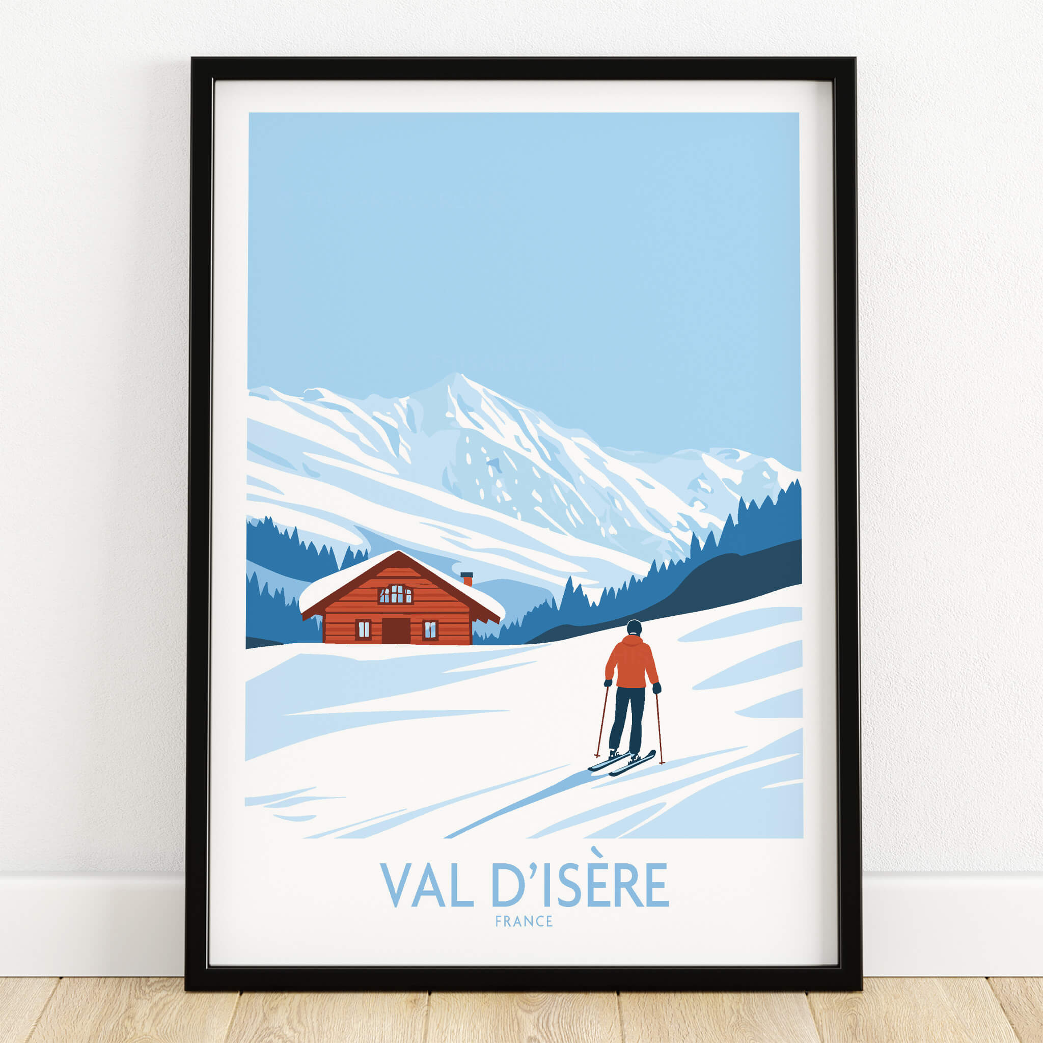 Val-d'Isère Print France ski poster featuring a skier and a chalet in a snowy landscape.