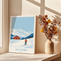 Val-d'Isère Print France poster featuring a skier on snowy slopes and a cozy cabin.