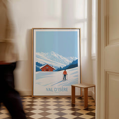 Val-d'Isère Print France ski poster in a stylish interior setting with person walking by.