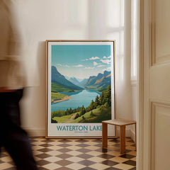 Framed Waterton Lakes National Park travel poster on floor in bright entryway, man walking past.