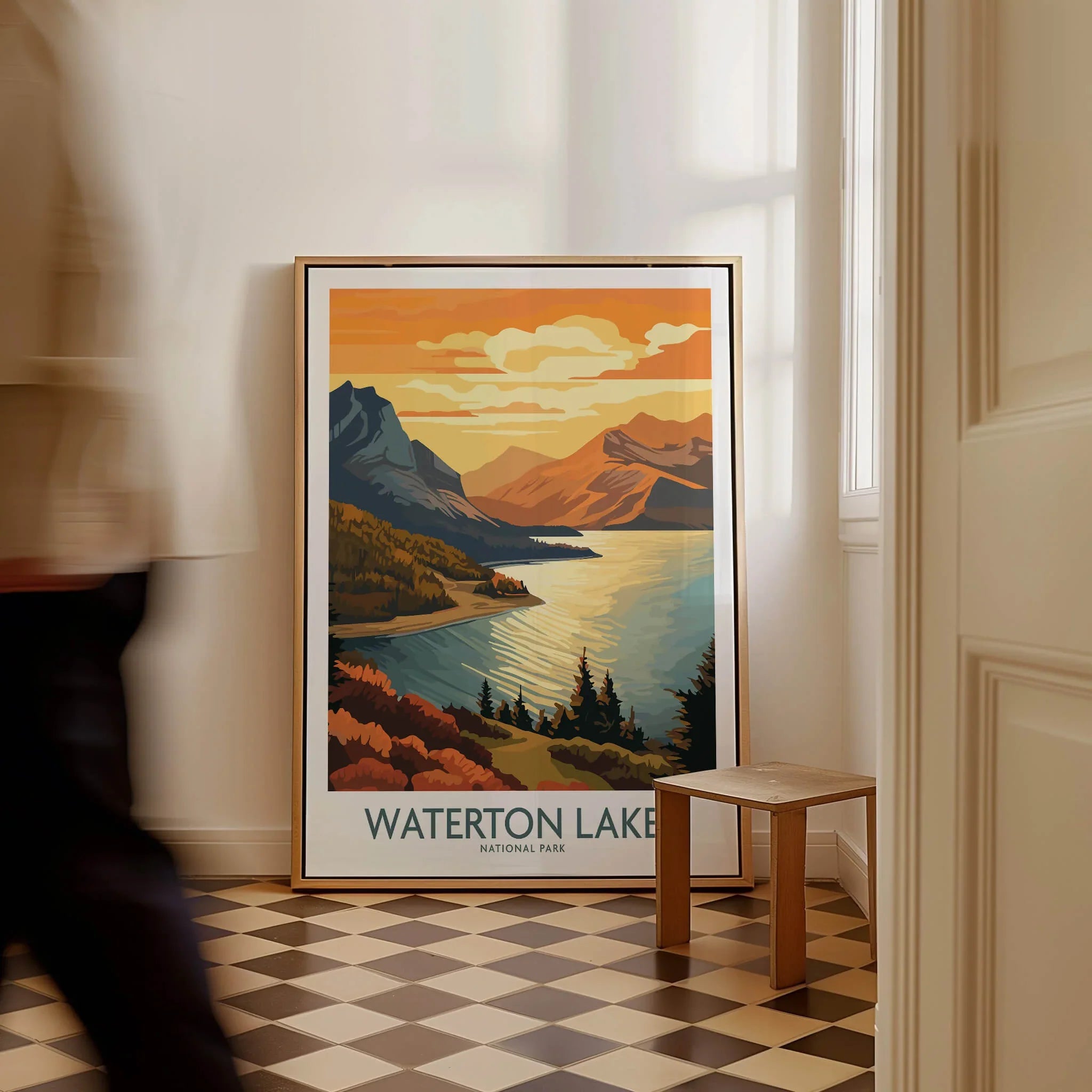 Framed Waterton Lakes National Park travel poster on floor, person walking past, home decor