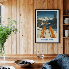Winter Park Wall Art - Colorado Ski Poster showcasing skis against a scenic mountain backdrop in a cozy interior.