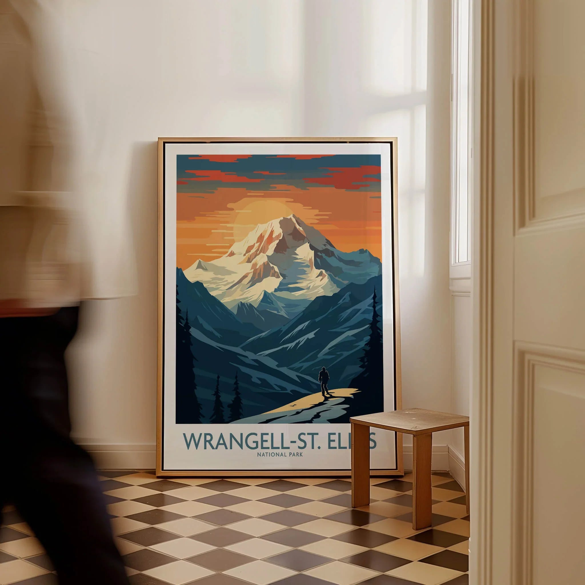 Framed Wrangell-St. Elias National Park travel poster with mountain art resting on the floor.