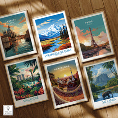 Set of six framed travel posters featuring Venice, Paris, Barcelona, Singapore, Sri Lanka, and Wrangell-St. Elias on a wooden floor.