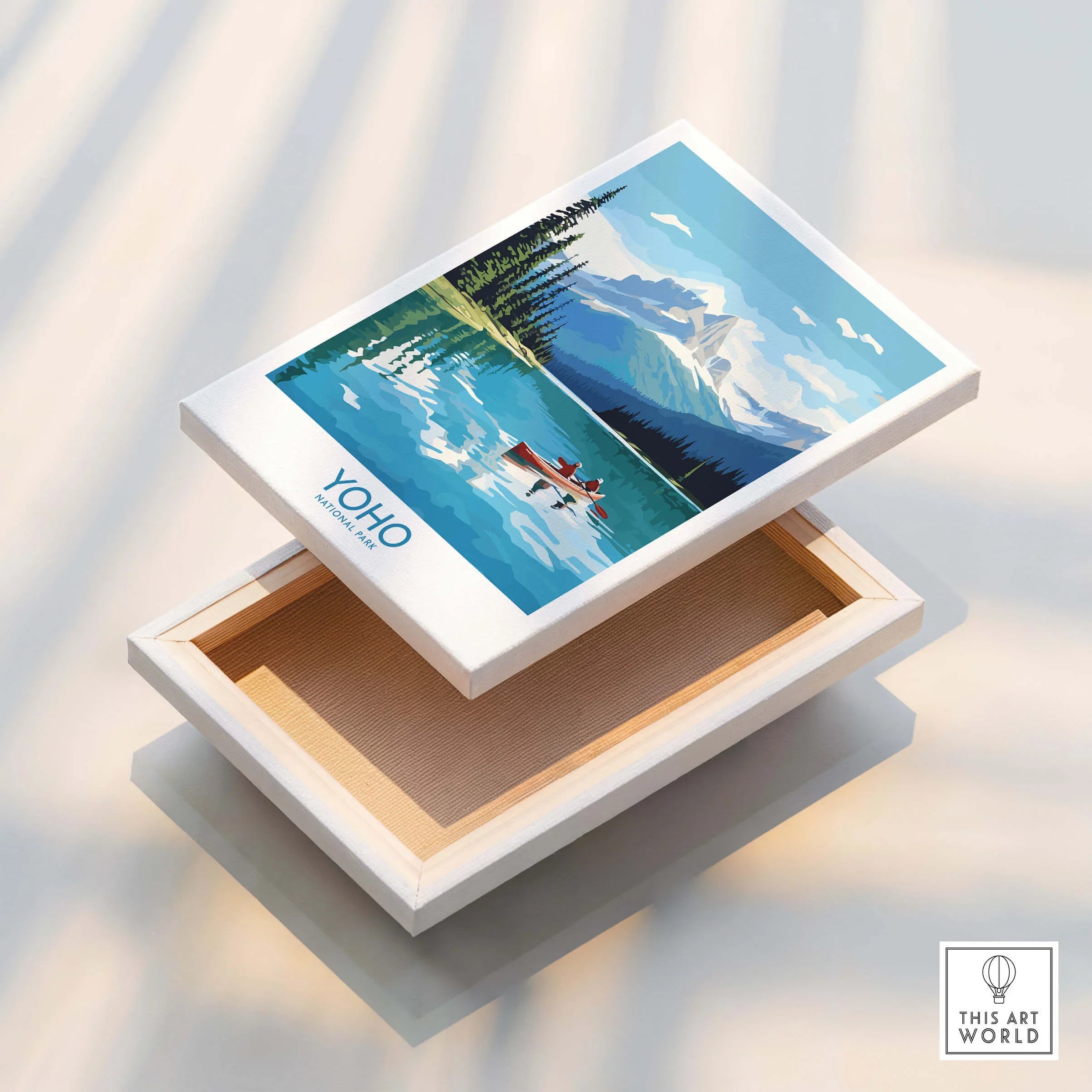 Yoho National Park wall art print with lake, canoe, pine trees, and mountains on canvas.