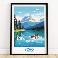 Yoho National Park art print in black frame, showing a lake, mountains, and canoe on floor