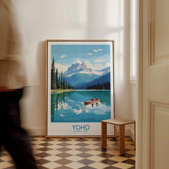 Framed Yoho National Park travel poster with lake and mountains, leaning on floor in hallway