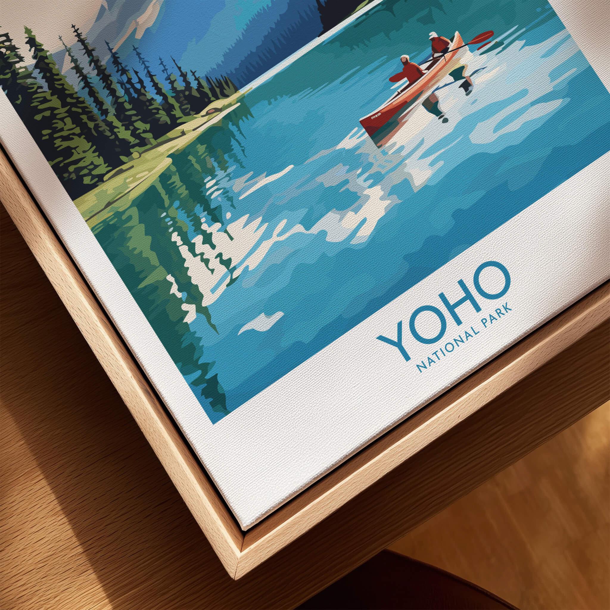 Yoho National Park art print with canoe on lake, framed in natural wood floating frame