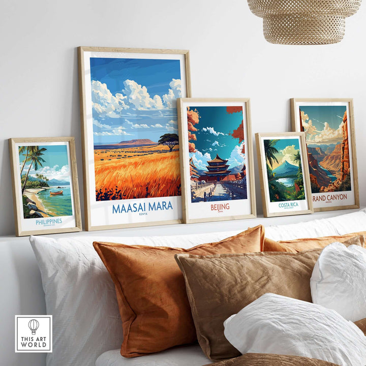 Vibrant Maasai Mara art print displayed among framed travel-themed prints on a stylish sofa.