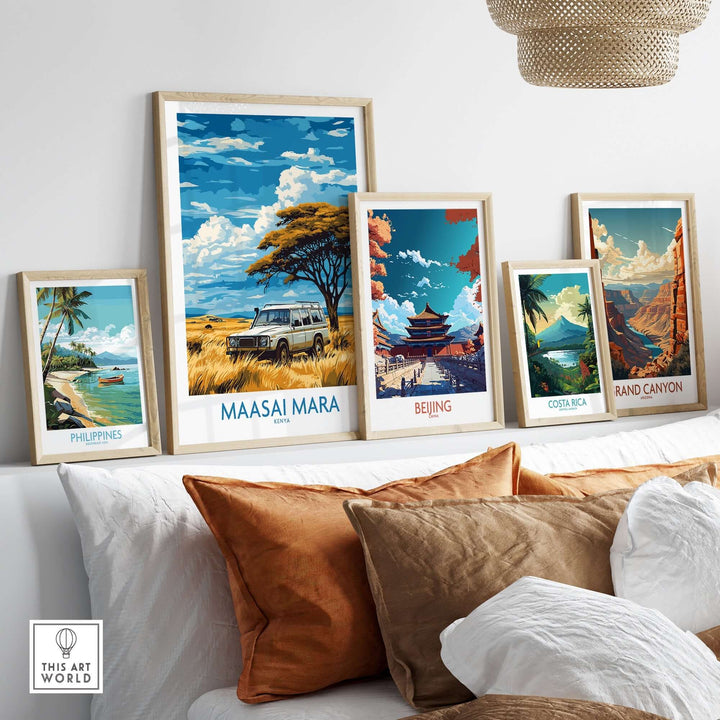 Maasai Mara travel poster displayed among other travel art on a stylish couch, showcasing vibrant landscapes and cultures.