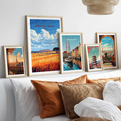 Maasai Mara Wall Art displayed among other framed travel posters on a stylish living room wall.
