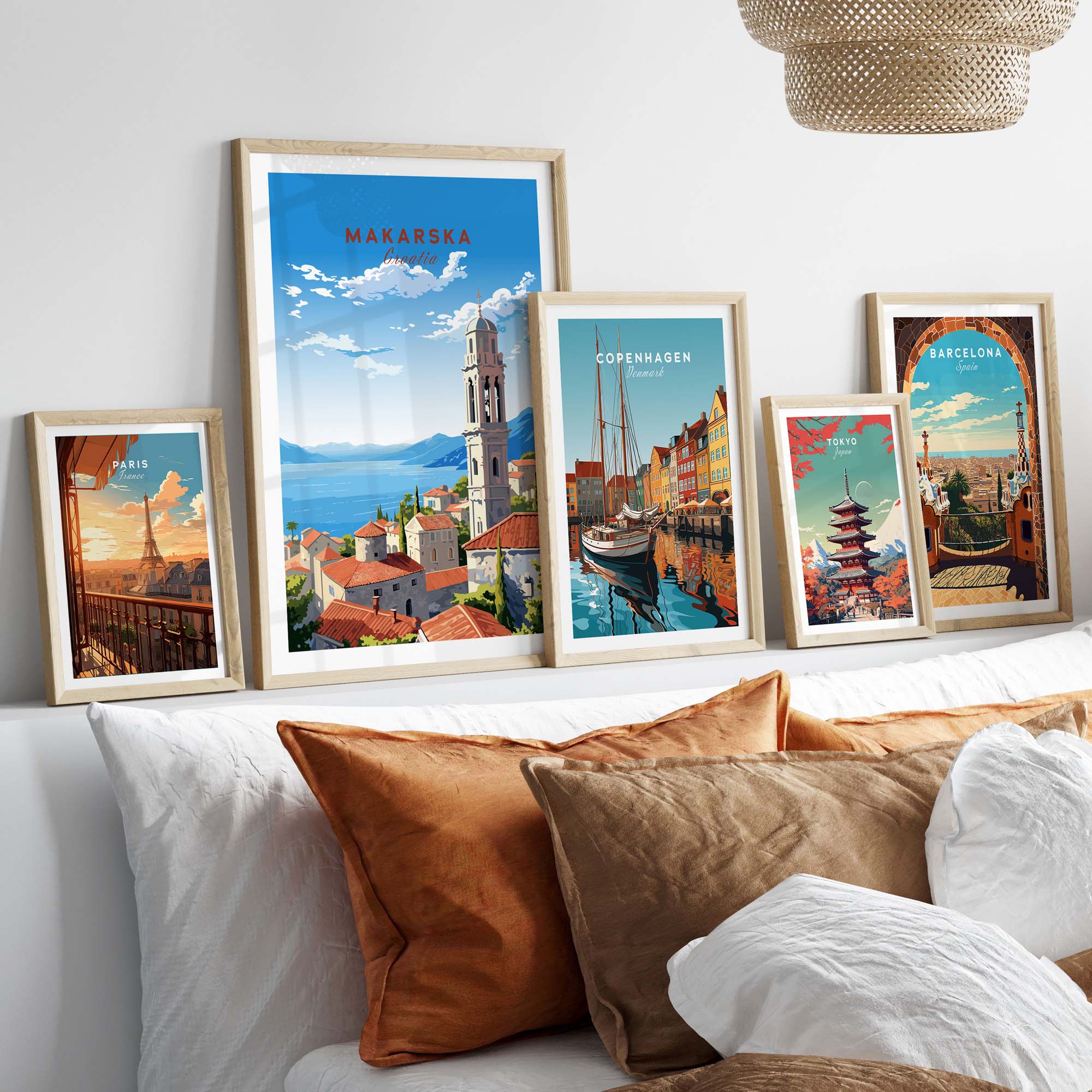 Makarska Croatia travel poster print displayed among other city art prints on a stylish bedroom wall.