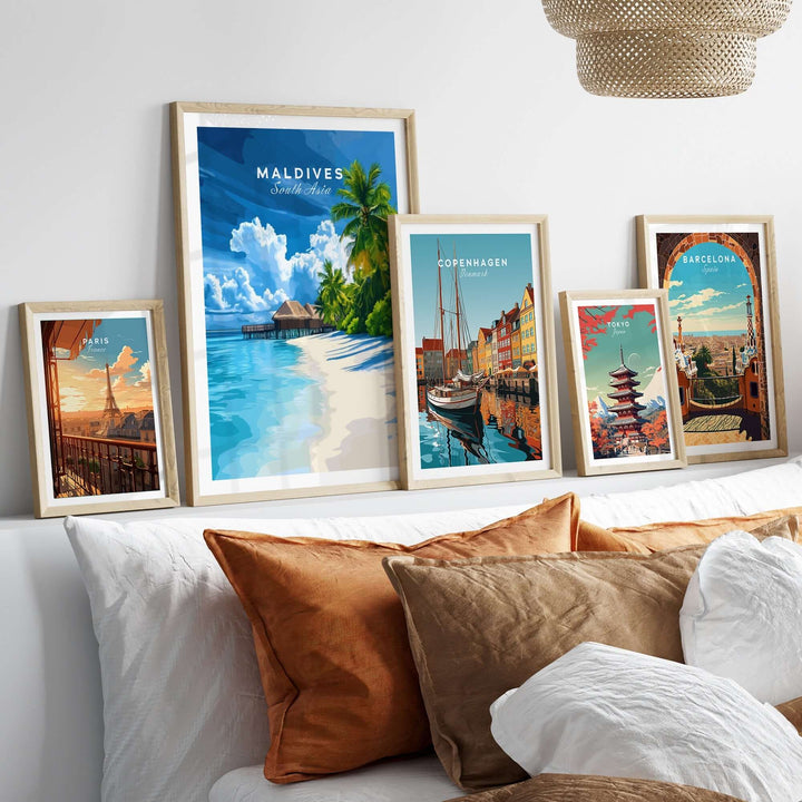 Framed Maldives print featuring a tropical beach scene, displayed with travel art from Copenhagen and Barcelona.