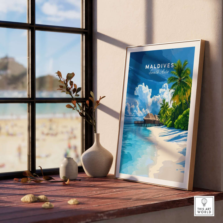 Maldives tropical beach print on a wooden table by a window, featuring clear waters and palm trees.