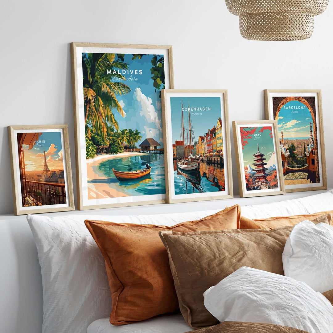 Beautiful Maldives travel print showcased among framed artworks on a cozy sofa setting. Perfect for home decor.