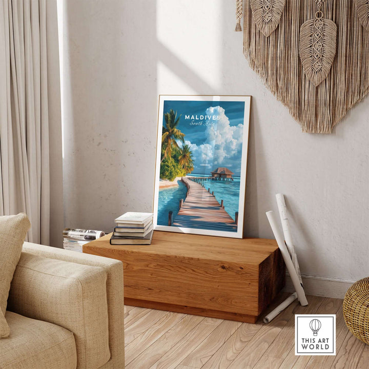 Maldives travel print featuring a serene beach scene with a wooden walkway and tropical greenery in a cozy interior setting.