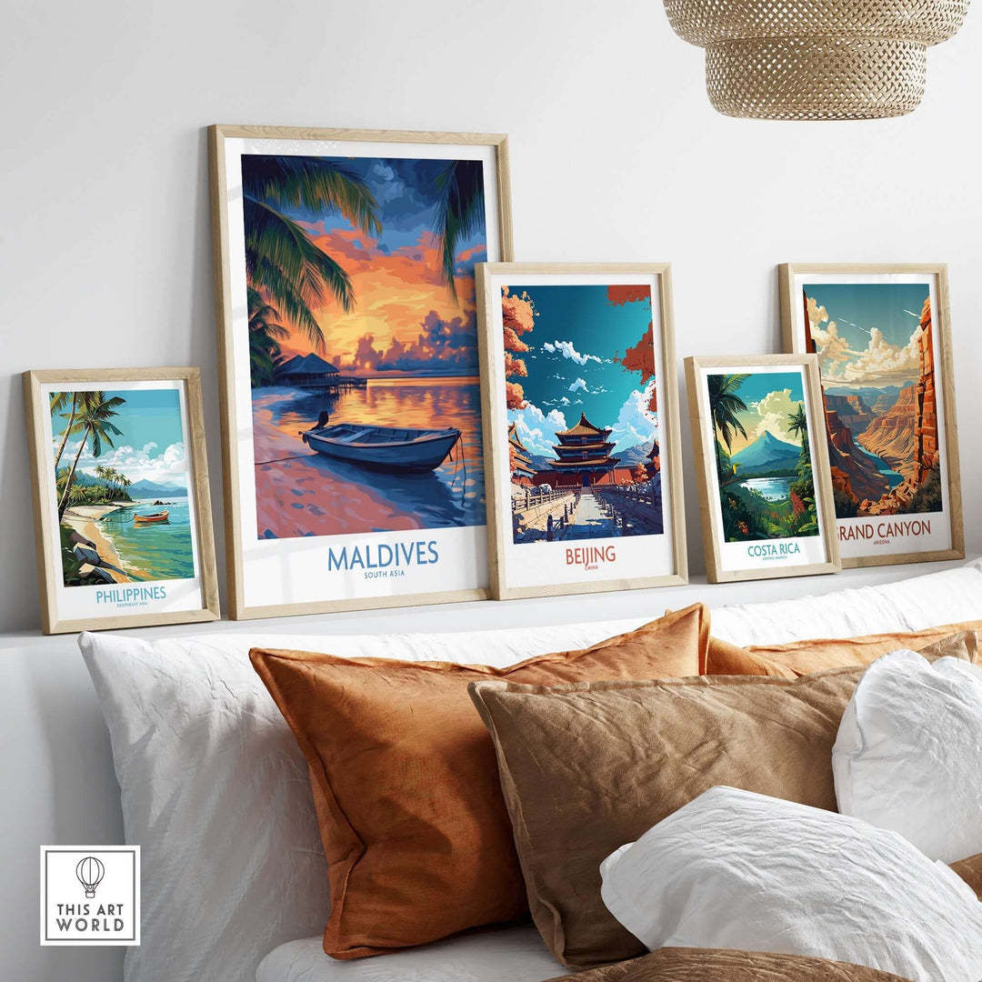 Beautiful wall art prints featuring sunset in the Maldives and other scenic locations, displayed on a cozy couch.