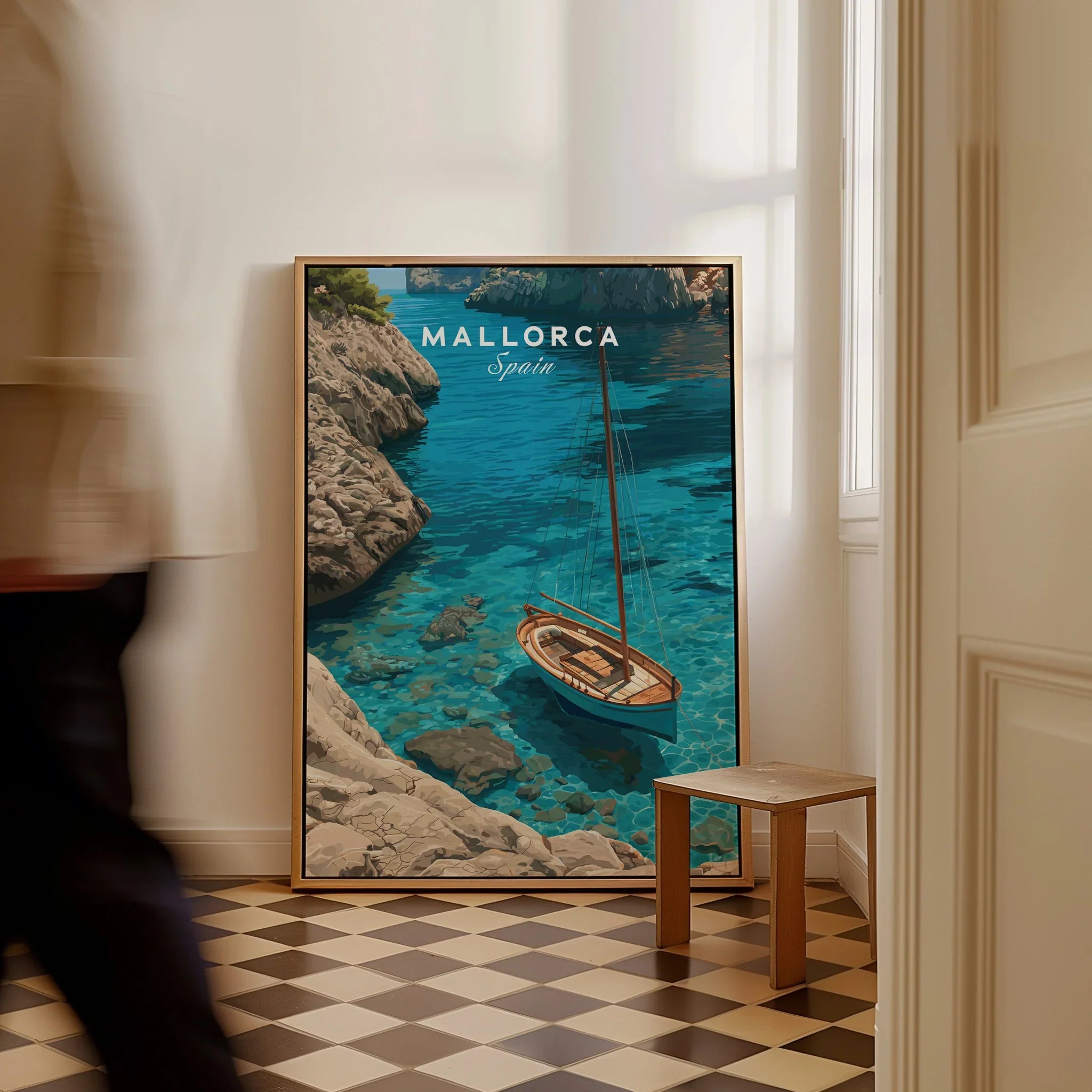 Mallorca Spain Sailboat Cove Travel Poster — framed canvas on floor man walking past