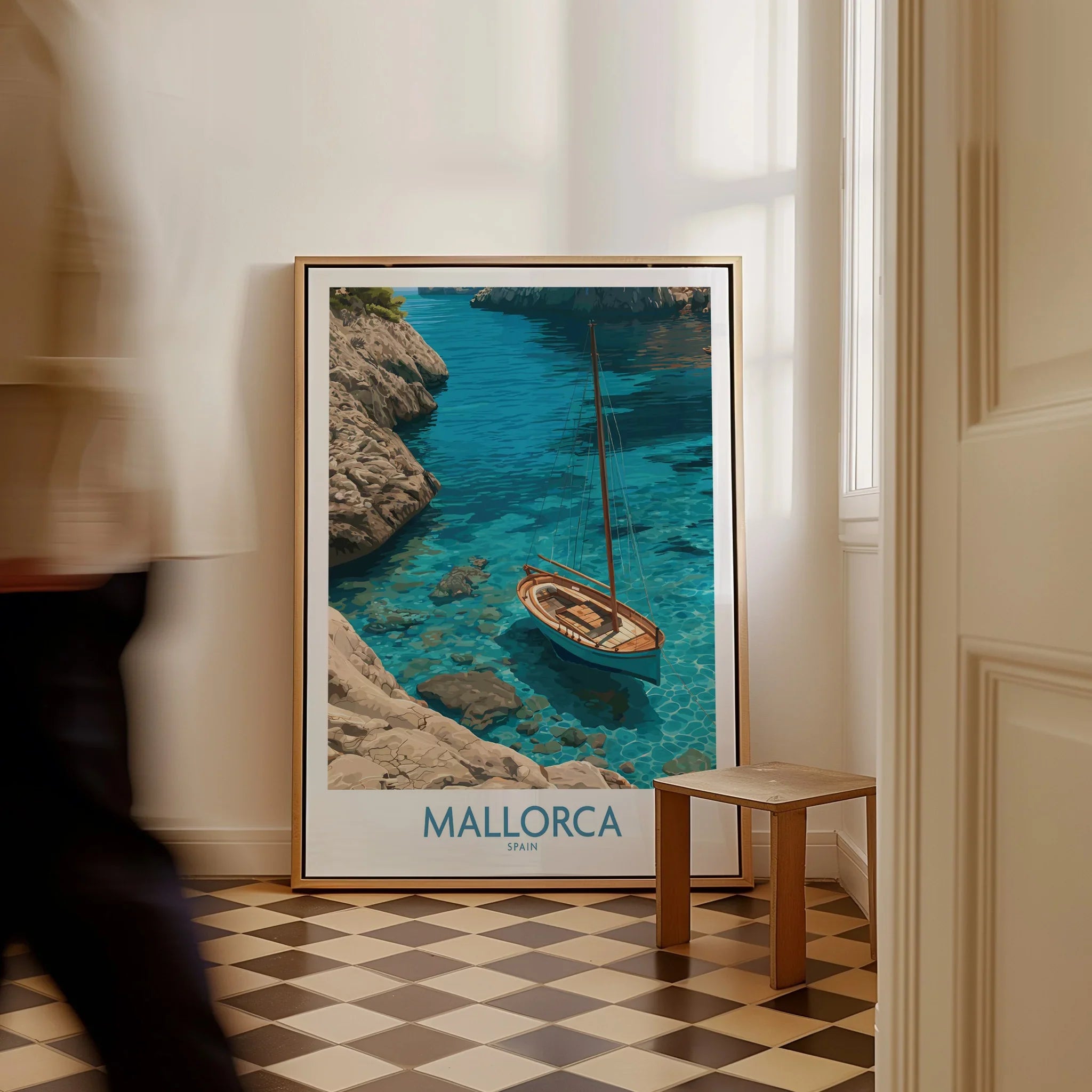 Mallorca Spain Cove Sailboat Wall Art — framed canvas on floor man walking past