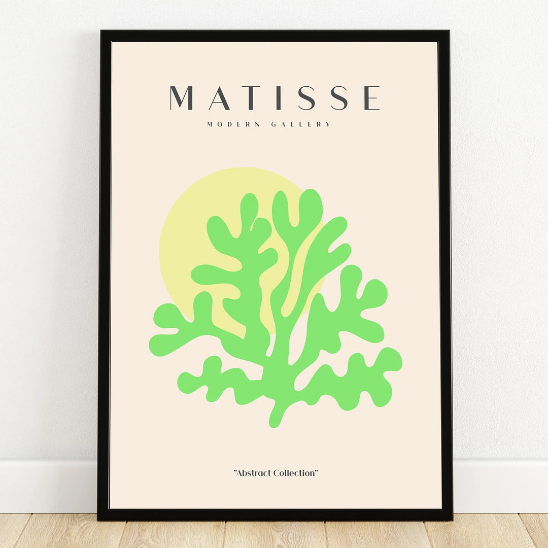 Modern abstract art print with green botanical shape, yellow circle, black frame