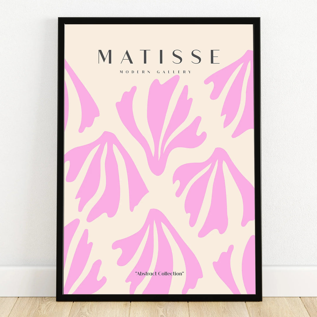Framed abstract wall art print with bold pink shapes and modern gallery text on cream background