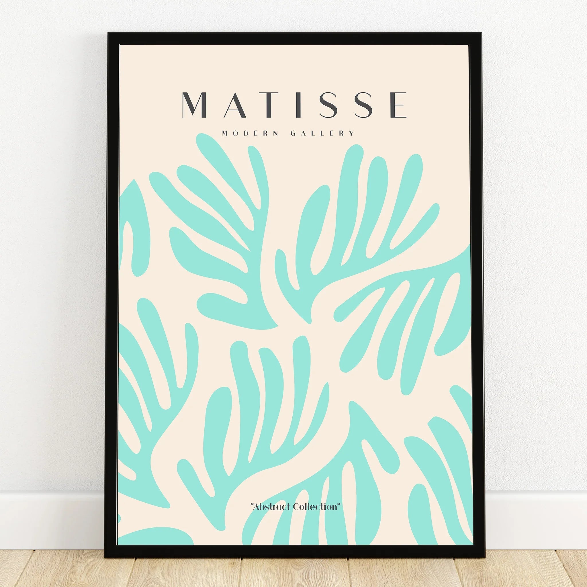 Framed abstract wall art print with turquoise organic leaf shapes on cream background