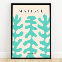 Framed abstract art poster with teal organic shapes on a beige background, leaning on wall