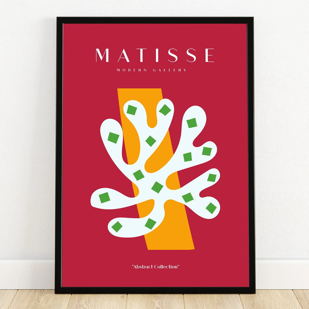 Modern abstract art print with bold shapes in red, white, yellow, and green, black frame
