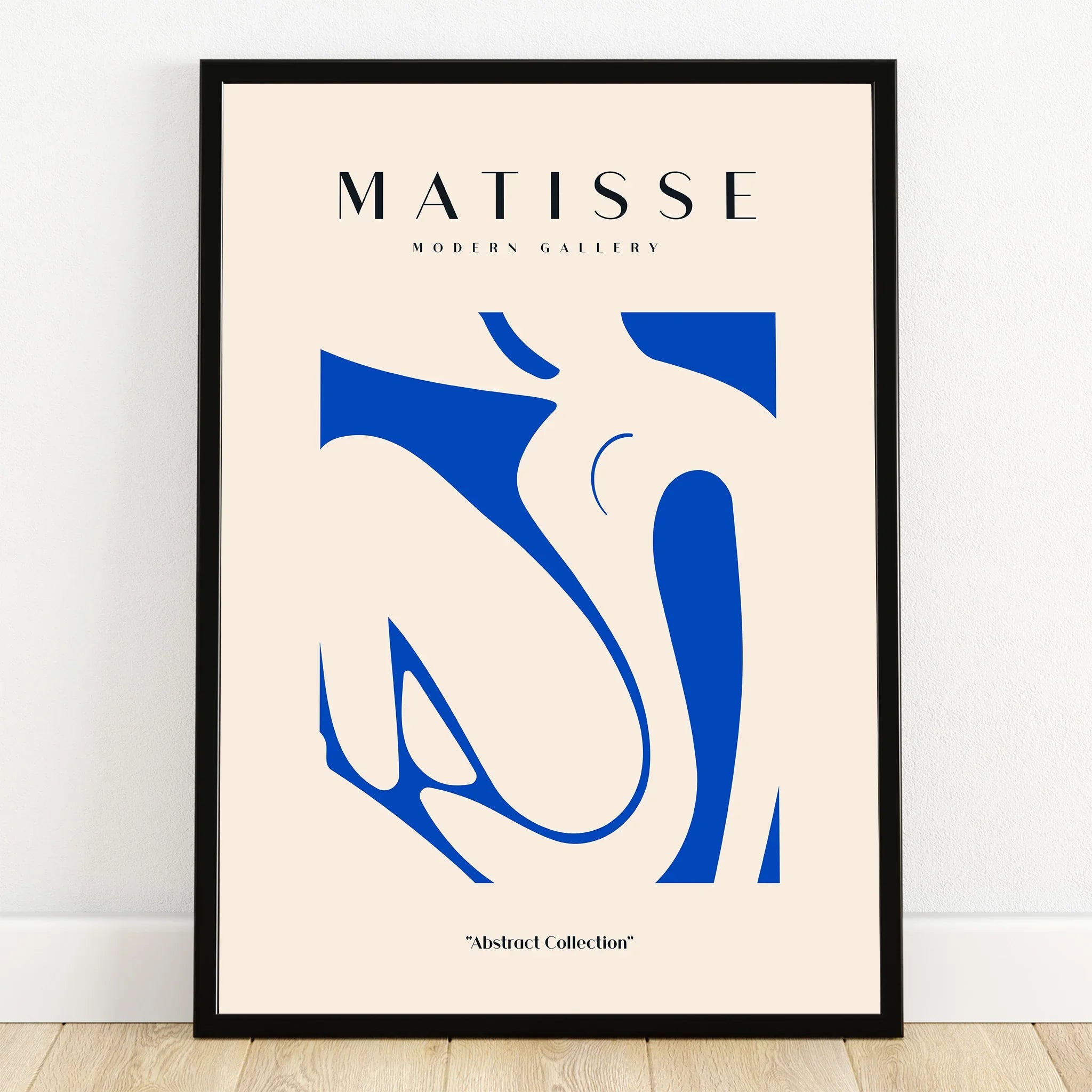 Framed abstract blue and beige Matisse-inspired wall art print in minimalist room