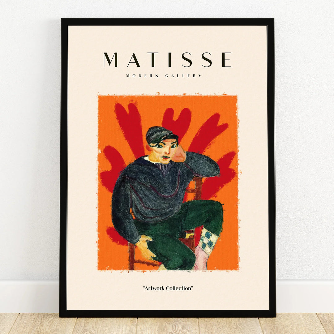 Framed Matisse style print featuring seated figure on vibrant orange and red abstract background