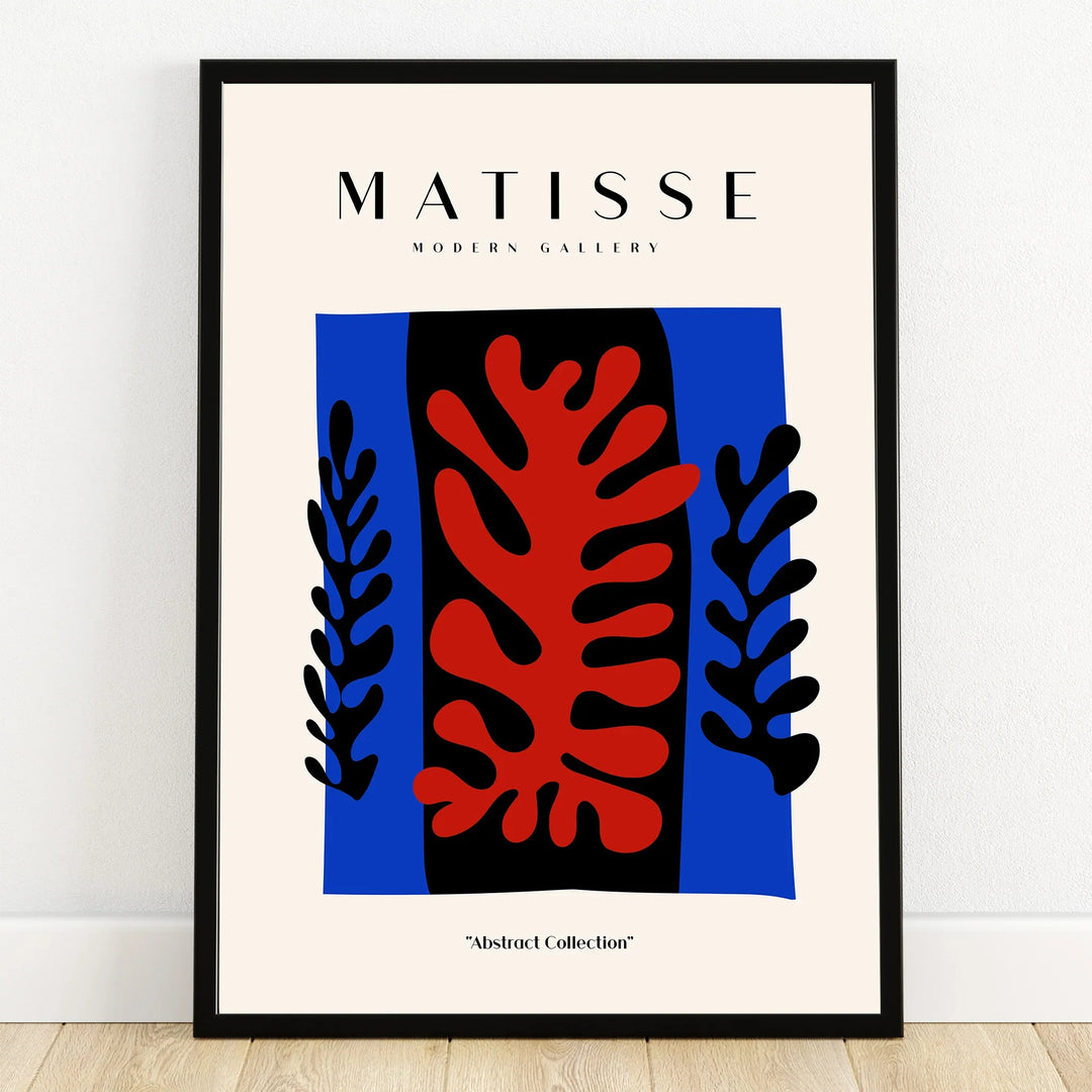 Abstract wall art poster with bold red and black leaf shapes on a blue background in black frame
