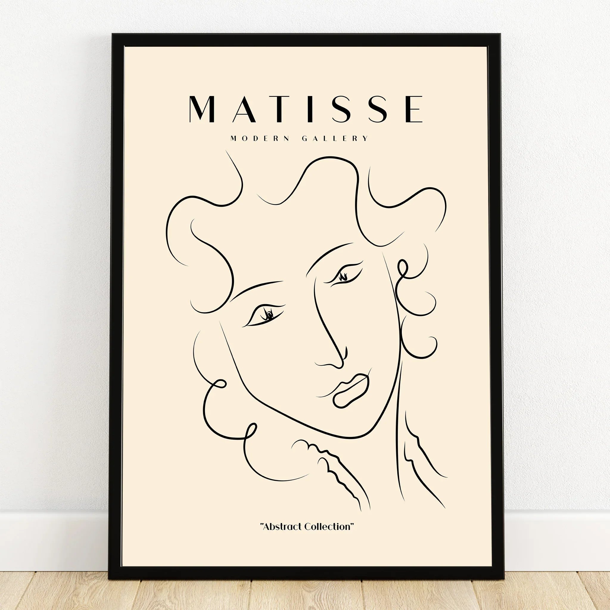 Minimalist abstract face line art print in black frame, modern wall decor