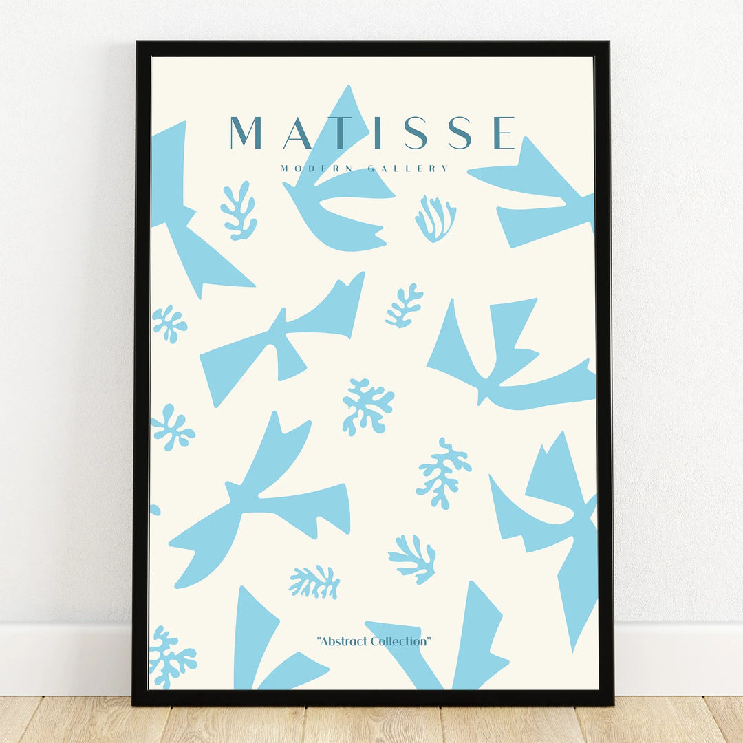 Framed abstract art print with light blue cut-out shapes on a white background, modern wall decor.